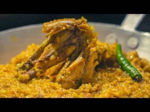Khicuri with chicken and egg