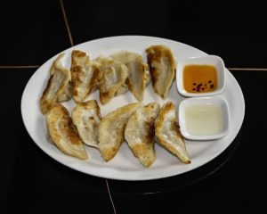 7. Grilled Pork Dumplings (10) / 放鍋貼: